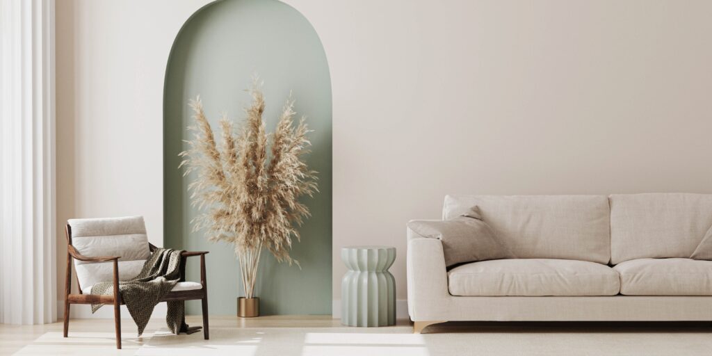 Elegant living room with soft nude tones, featuring a beige sofa, light wood furniture, and neutral decor for a serene and stylish atmosphere